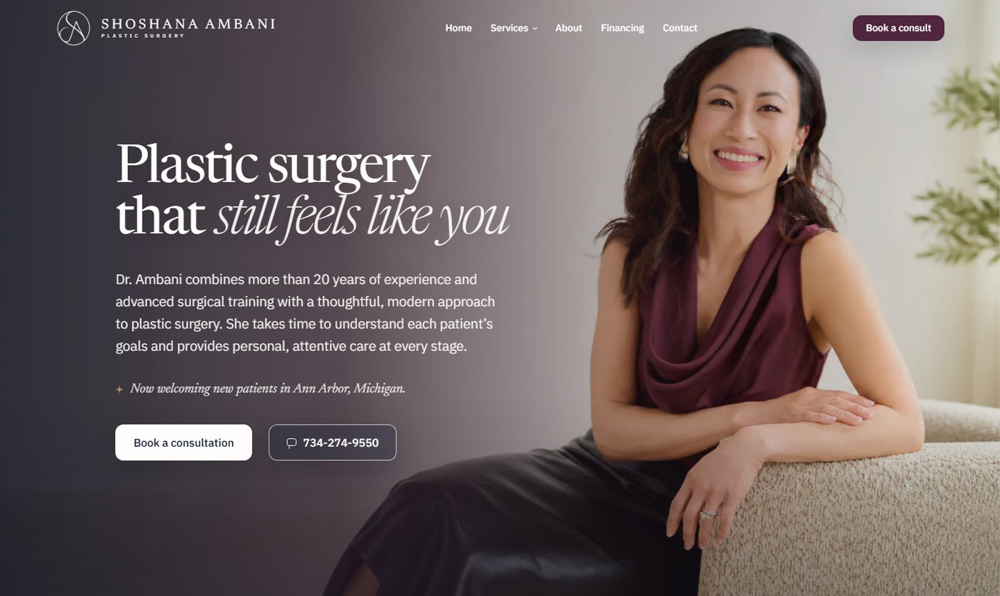 The shipped homepage hero on shoshanamd.com: dark plum treatment, Dr. Ambani seated, headline Plastic surgery that still feels like you